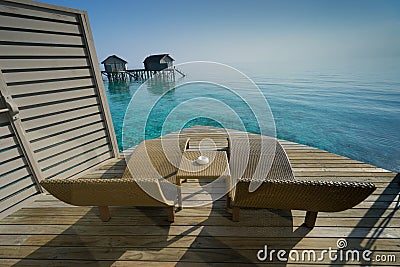 Two deck chairs on a sea view balcony Stock Photo