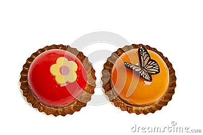 Two delicious looking small round cakes isolated on a white background Stock Photo