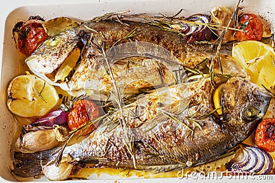 Two delicious whole baked fish. Stock Photo