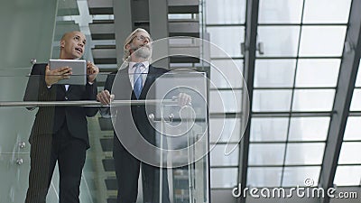 Design professionals having a discussion in modern building Stock Photo