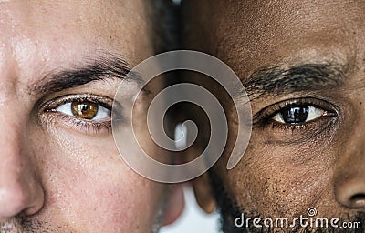 Two different ethnic men`s eyes closeup Stock Photo