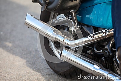 Two direct exhaust pipes on chopper motorcycle, chrome loud sound silencer Stock Photo