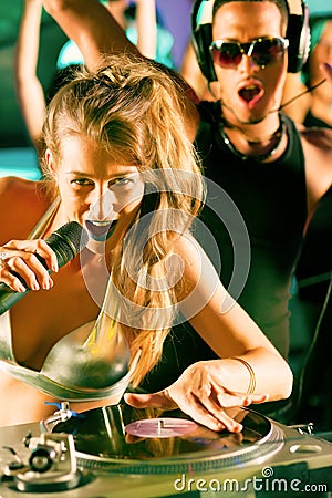 Two DJs at the turntable in club Stock Photo