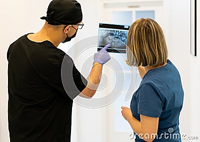 Two doctors checking x-ray image in hospital, high quality photo Stock Photo