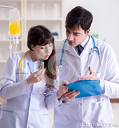 Two doctors discussing plasma and blood transfusion Stock Photo