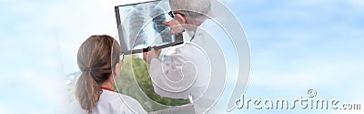 Two doctors examining x-ray report Stock Photo