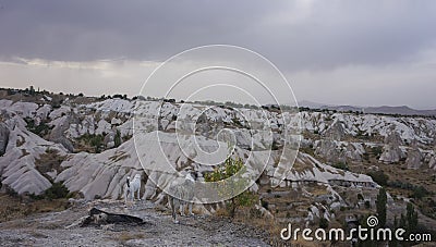 Two dogs looking at valley in stormy weather, Cappadoccia Stock Photo