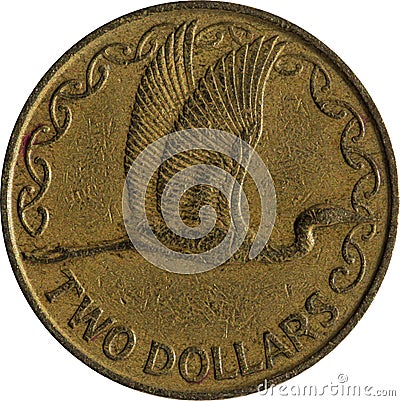 A Two Dollars New Zealand Coins. The bird featured on the aluminium-bronze $2 NZD piece is a white heron, or `Kotuku` Stock Photo