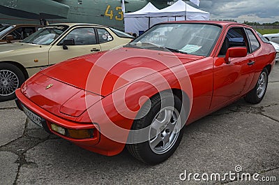A two-door red sports car Porsche 924 1984 at the exhibition or retro cars in Kyiv Editorial Stock Photo