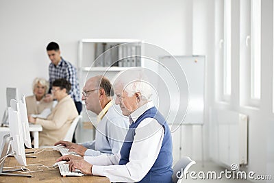 Elder men using computers Stock Photo