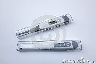 Two electronic thermometers on white isolate Stock Photo