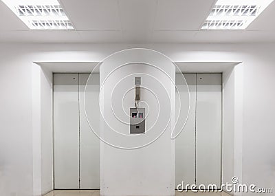 Two elevators inside white building Stock Photo