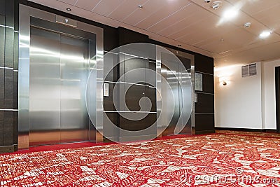 Two elevators with metal doors in hotel Stock Photo