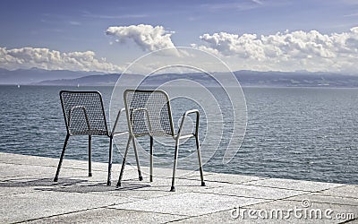 Two empty metallic chairs Stock Photo