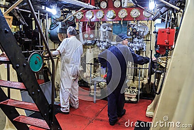 The engine room of an old steam tugboat Editorial Stock Photo