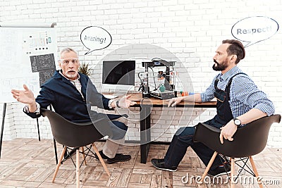 Two engineers work in a modern laboratory with a 3d printer. They have conversational clouds over their heads. Stock Photo