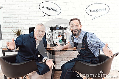 Two engineers work in a modern laboratory with a 3d printer. They have conversational clouds over their heads. Stock Photo