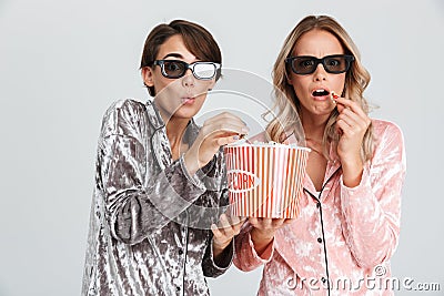 Two excited girls wearing pajamas standing Stock Photo