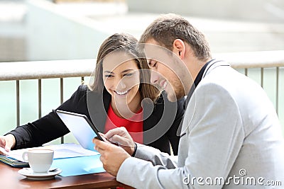 Two executives consulting on line data Stock Photo