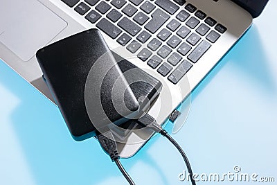 Two external or portable hard drive HDD connected to laptop Stock Photo