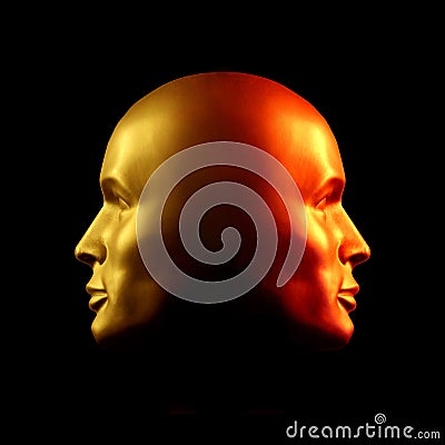 Two-faced head statue, red and gold Stock Photo