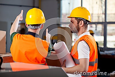 Two factory engineers discussing Stock Photo