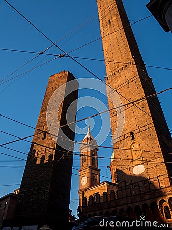 Two famous falling Bologna towers Asinelli and Garisenda in sunset Editorial Stock Photo