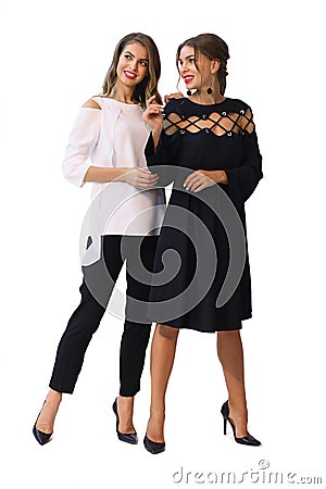 Two fashion model girl in black and white formal party dress clothes Stock Photo