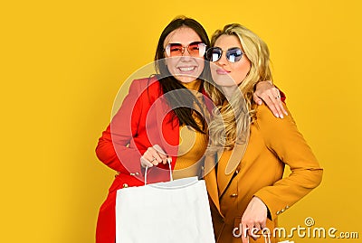 Two female carry shopping bags. big sales and black friday. bright autumn colors. autumn and spring fashion style Stock Photo