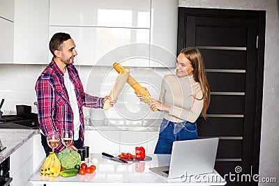 Two female and male competitors struggle for winning culinary contest, target at each other have irritated and furious expressions Stock Photo