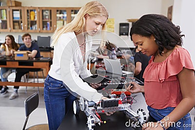 Two Female Pupils Building Robotic Vehicle In Science Lesson Stock Photo