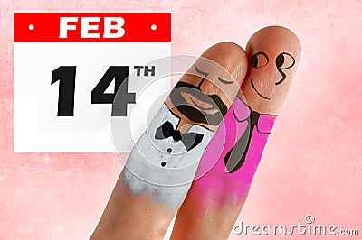 Fingers with cartoon man face painted as happy and free homosexual couple in love celebrating Valentines day in gay rights Stock Photo