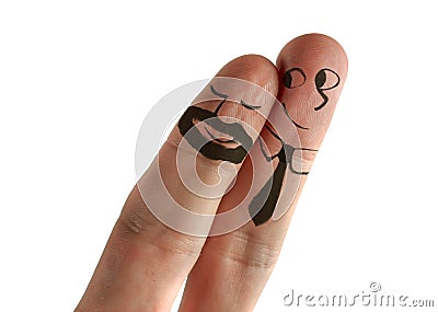 Two fingers with cartoon man face painted as happy and free homosexual couple in love celebrating Valentines day or getting Stock Photo