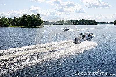 Two Fishing Boats Crossing in a Lake Saimaa, Finland Editorial Stock Photo