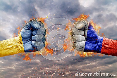 Two fist with the flag of Russia and Ukraine faced at each other Stock Photo