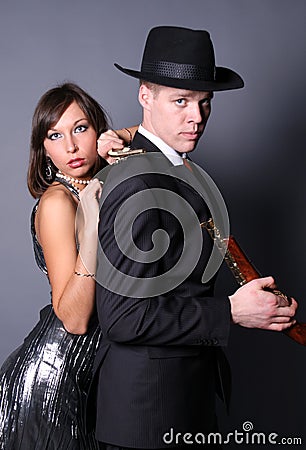 Two flirting gangsters Stock Photo