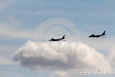 Black silhouettes flying Russian Tu-95 strategic bombers against the sky NATO reporting name: `Bear Stock Photo