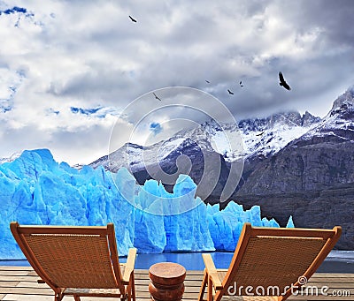 Two folding wooden chairs and Perito Moreno glacier Stock Photo