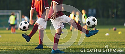 Two football players juggle soccer balls Stock Photo