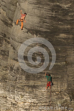 Two friends climbing sandstone rock Editorial Stock Photo