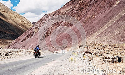 Two friends go by motorcycle by the Leh - Manali highway in high Himalayas Mountain, India Stock Photo