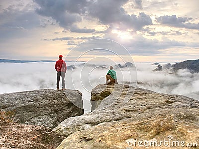 Two friends, hiker thinking and photo enthusiast takes photos of fall Stock Photo