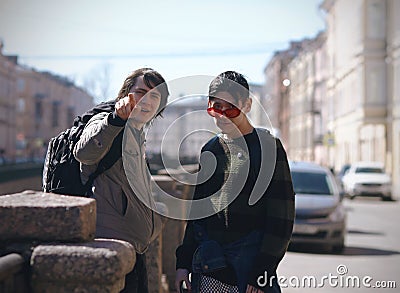 The two friends , one of which shows the way Stock Photo