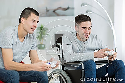 Two friends playing video game Stock Photo