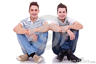 Two friends sitting next to each other Stock Photo