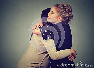 Two friends women hugging Stock Photo