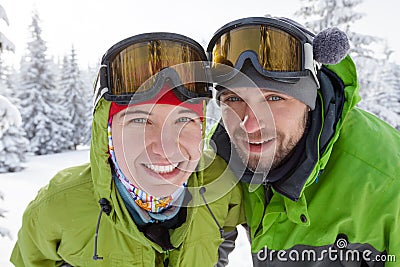 Two funnny hikers posing at camera in winter mountains Stock Photo