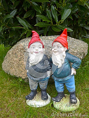 Two funny garden gnomes Stock Photo