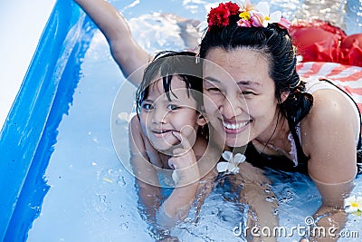 Two generation people swimming in Inflatable Pool at the summer time Stock Photo