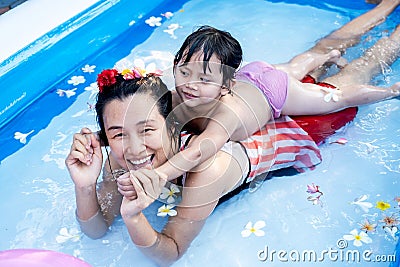 Two generation people swimming in Inflatable Pool at the summer time Stock Photo
